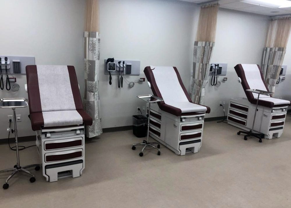 medical stations, exam tables, and equipment assembled at nursing school