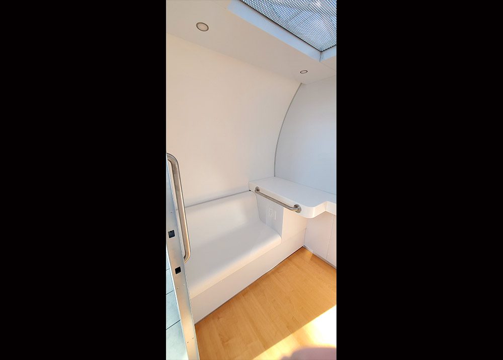 inside view of privacy lactation pod showing seat