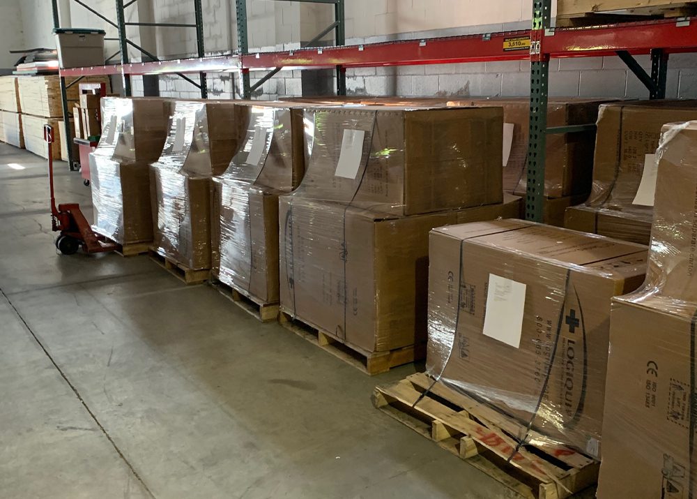 boxes of medical supply carts on pallets in warehouse
